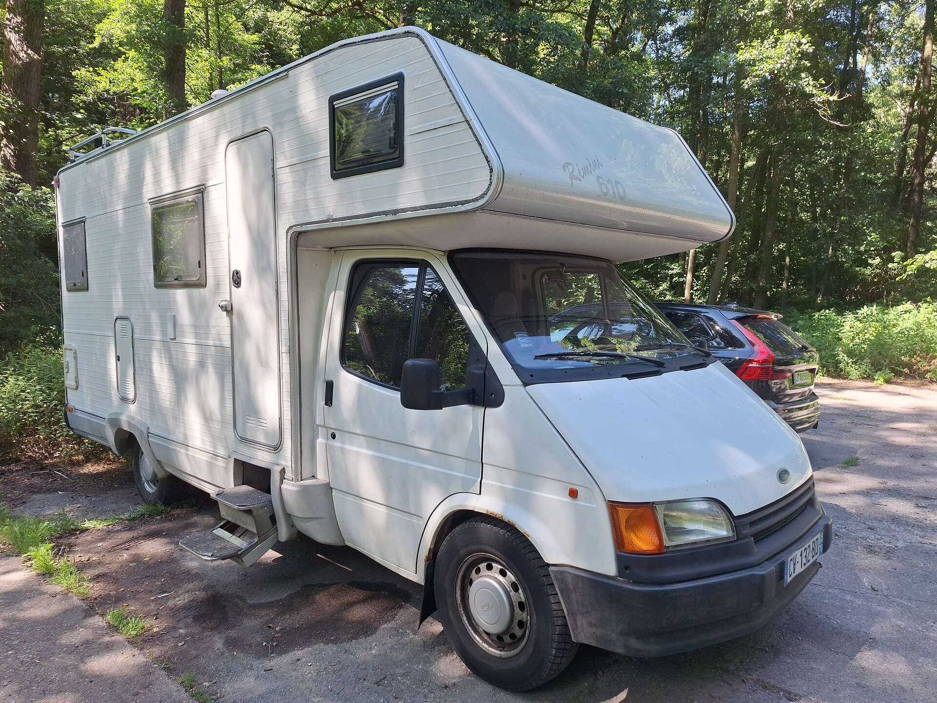 Motorhome based on a Ford Transit chassis with an overcab body parked at the Bockmühle car park in the Zeitzgrund valley near Schleifreisen, Thuringia, Ger