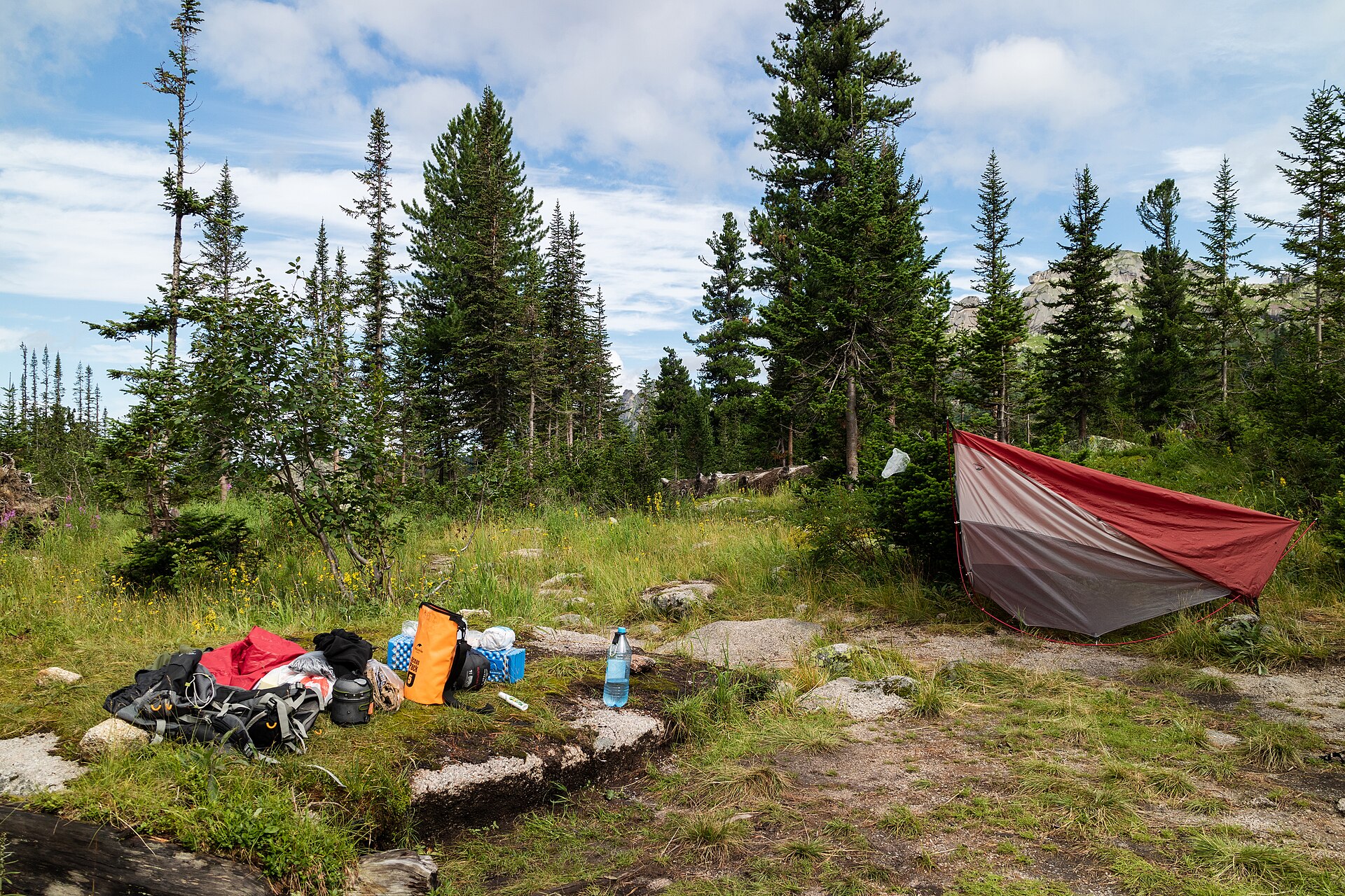 Campsite, camping equipment, outdoor gear in the wild